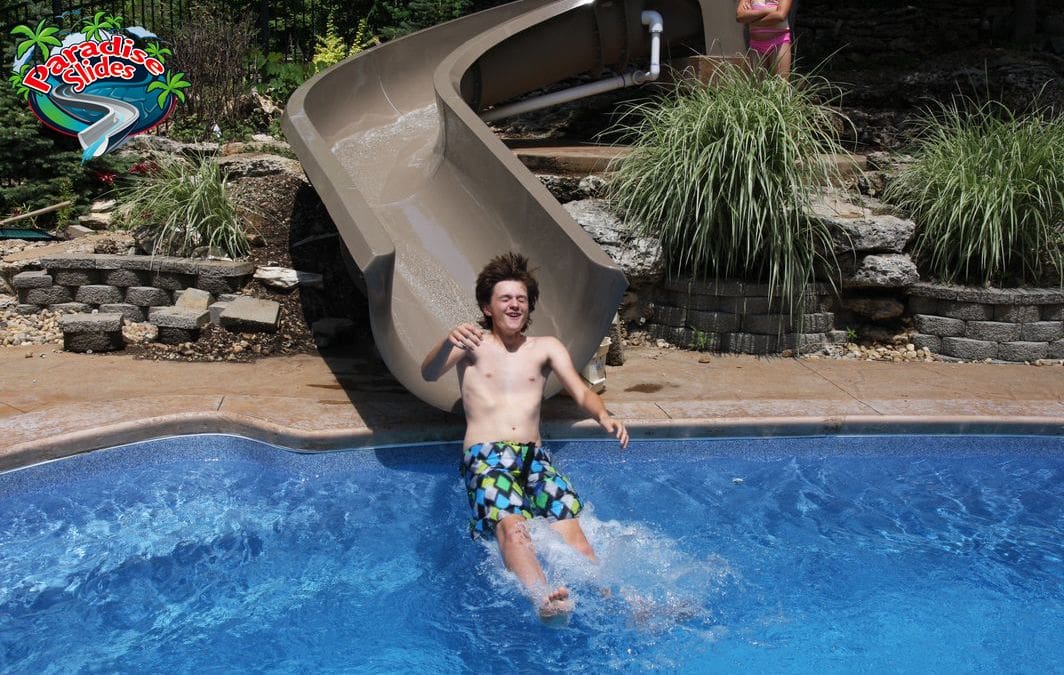 Custom PS24T5L-C fiberglass waterslide in cafe from Paradise Slides, ideal for inground backyard pool thrills